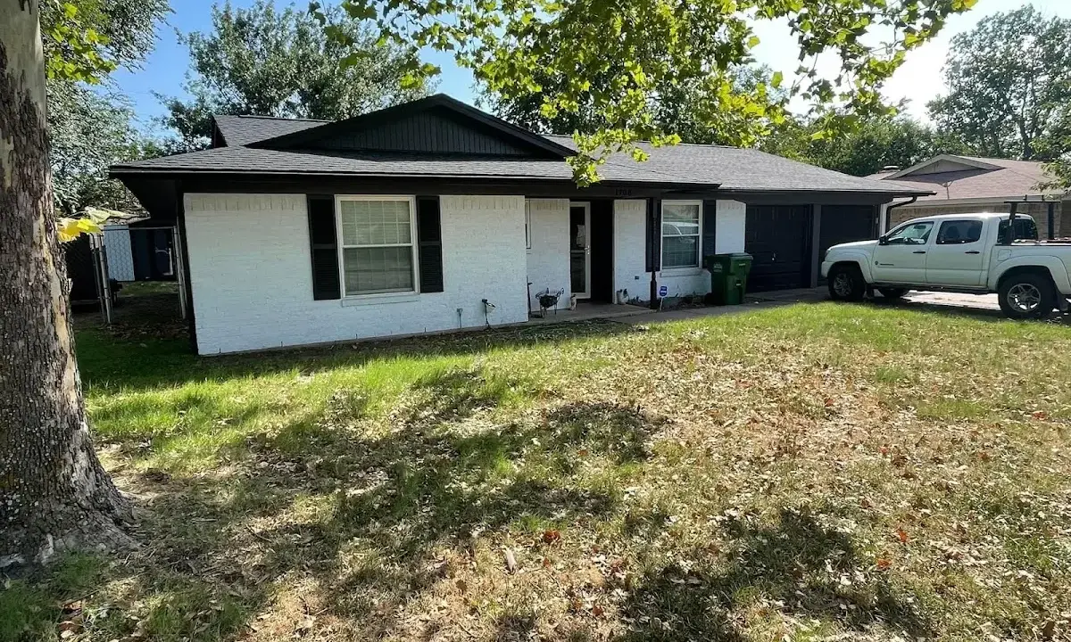 Professional roofing crew working on a residential roof in Spirit Lake